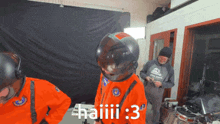 a man wearing a helmet says haiiii 3 in a room