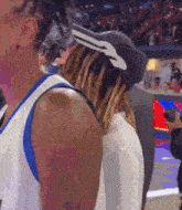 a basketball player wearing a hat with a key on it