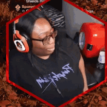 a woman wearing headphones and a t-shirt that says ' ninja ' on it