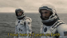 two astronauts standing next to each other with the words 1 hour here is 7 years on earth