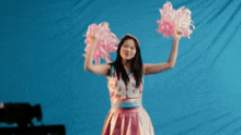 a girl in a cheerleader outfit with the number 48 on it
