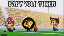 a baby yolo token is being held by two minions on a field