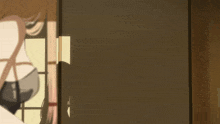 a man with a bandana on his head is standing in a doorway
