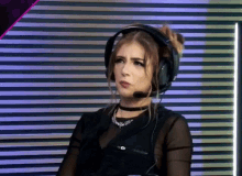 a woman wearing headphones with a microphone on her head