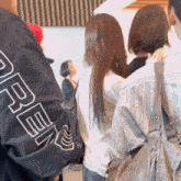 a person wearing a black jacket with the word open on it