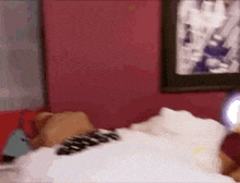 a blurry picture of a person laying on a bed in a bedroom .