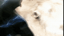 a close up of a person 's face with lightning in the background .