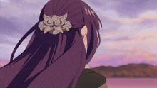 a woman with long purple hair and a purple hair clip