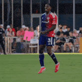 a soccer player wearing a jersey with the number 3 on it