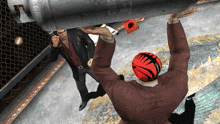 a man in a suit is standing next to a man wearing a red bowling helmet