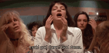 a woman with her mouth open says i said god damn