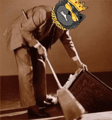 a man in a suit and a crown is sweeping the floor