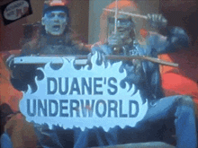 a sign that says duane 's underworld is displayed