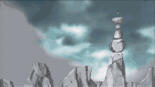 a person is standing on top of a pile of rocks
