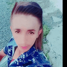 a woman taking a selfie with a blue shirt on