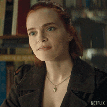a close up of a woman 's face with netflix written on the bottom right