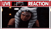 a picture of a woman in a tiger costume with the words live reaction above her