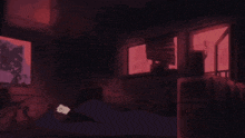 a girl is covering her face with her hands in a dark room