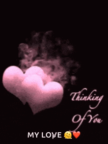 a couple of pink hearts with smoke coming out of them and the words `` thinking of you ''