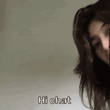 a woman is talking on a cell phone and the words hi chat are above her