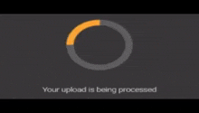 a gray background with a circle and the words your upload is being processed