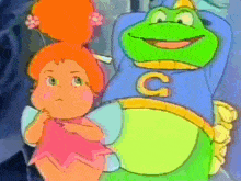 a frog with the letter c on his chest is standing next to a little girl