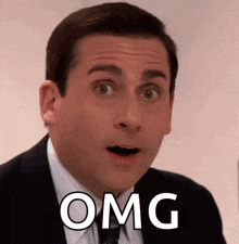 a man in a suit and tie is making a surprised face with the word omg written on his face .