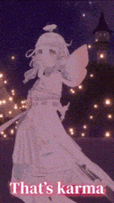 a girl in a pink dress is standing in front of a castle and the words that 's karma