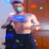 a man without a shirt is standing in front of a door with lights behind him