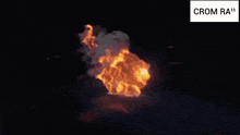a picture of a fire with the words crom ra ' on the bottom right