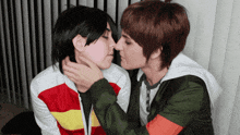 a man and a woman are kissing each other