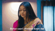 a woman in a saree with the words bahut saari cheezein karni hai on the bottom