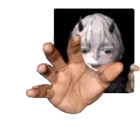 a hand is reaching out towards a picture of a person with horns