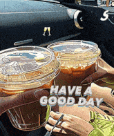 a picture of two cups of coffee with the words have a good day above them