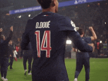 a man wearing a jersey with the number 14 on it