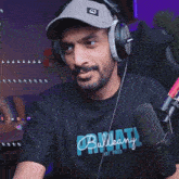 a man wearing headphones and a shirt that says " bulkany "