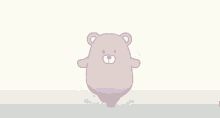 a purple teddy bear is laying on the ground with a towel on its back .
