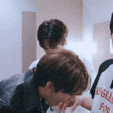 a man wearing a t-shirt that says congratulations for