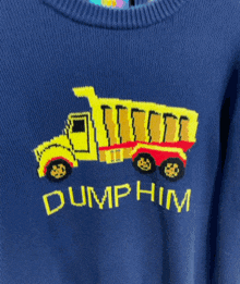 a blue sweater with a dump truck and the words dump him