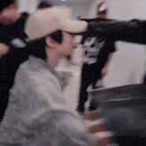 a blurry picture of a man in a baseball cap