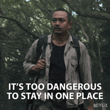 a man with a backpack says it 's too dangerous to stay in one place netflix
