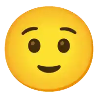 a yellow face with brown eyes and a smile on it