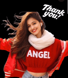 a woman wearing a red angel sweater is smiling