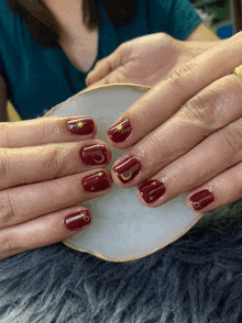 a close up of a woman 's nails with a crescent moon and star on them