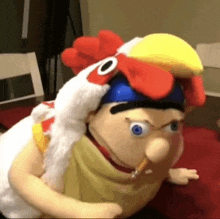 a stuffed animal is wearing a chicken hat and holding a pencil .