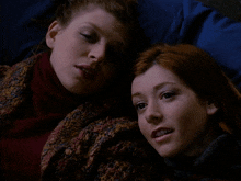 two women laying on a bed with the words hence the name