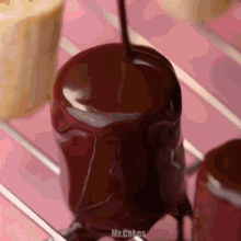 chocolate is being poured on a marshmallow with the words mr.cakes visible