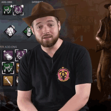 a man wearing a cowboy hat and a black shirt that says 8 on it