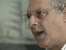 a close up of a man 's face with the words cala essa boca on the bottom