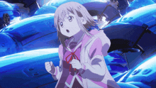 a girl in a pink hoodie stands in front of a bunch of blue objects